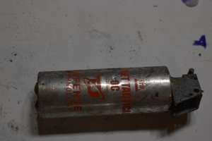 smaller silver grenade can with orange writing that says Pocket Tactical OC, background is white paper with a shadow